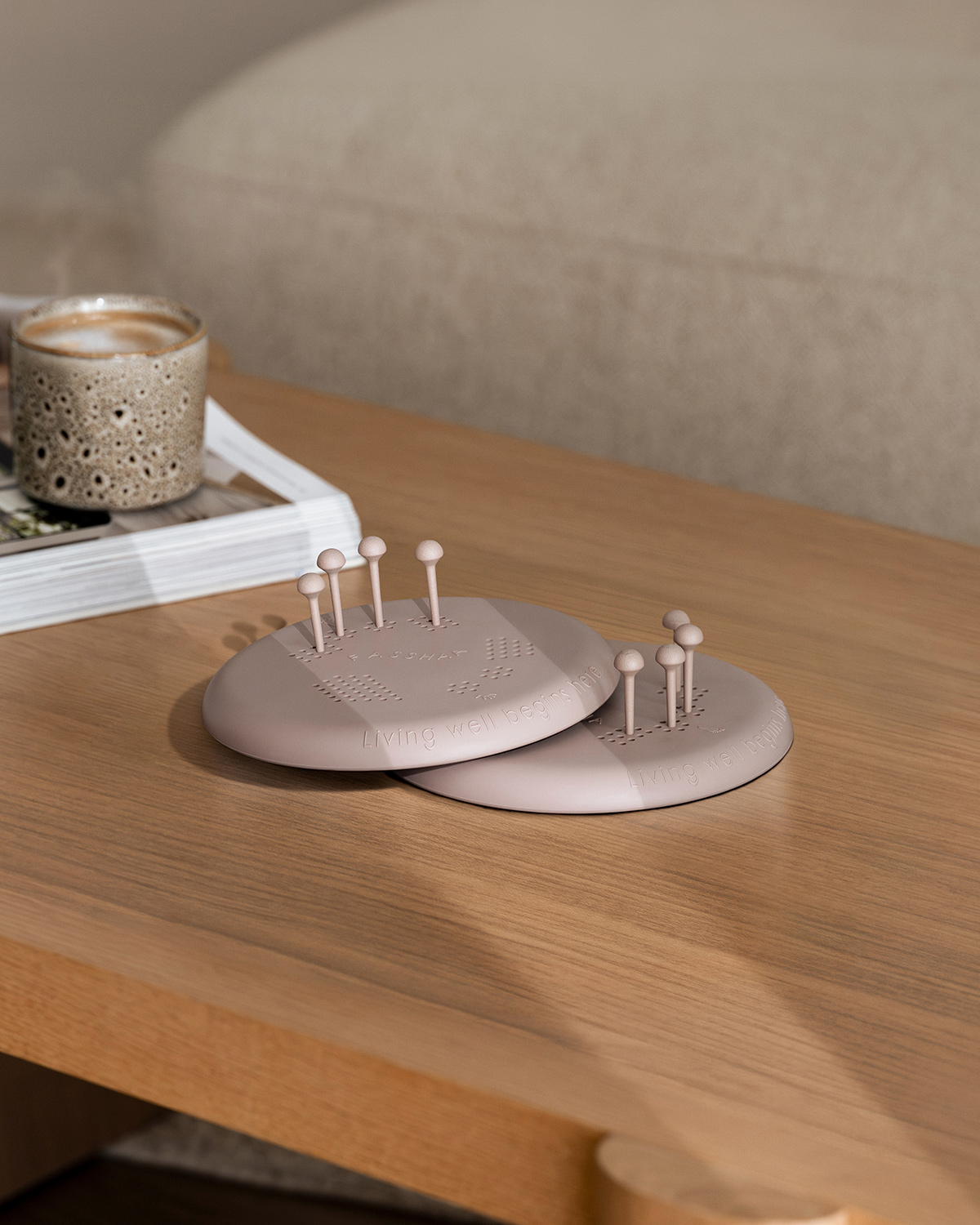 Two Fasshaa boards with pegs on a timber coffee table at home